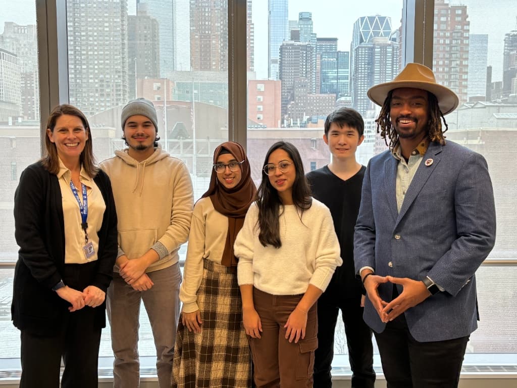 CUNY alum Blake Stoner with winners of the Vngle-sponsored John Jay College hackathon that helped inspire INI